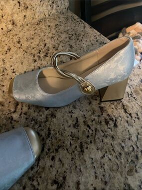 NWT, still in package Light Blue Satin Mary Jane Pumps with Gold Accent